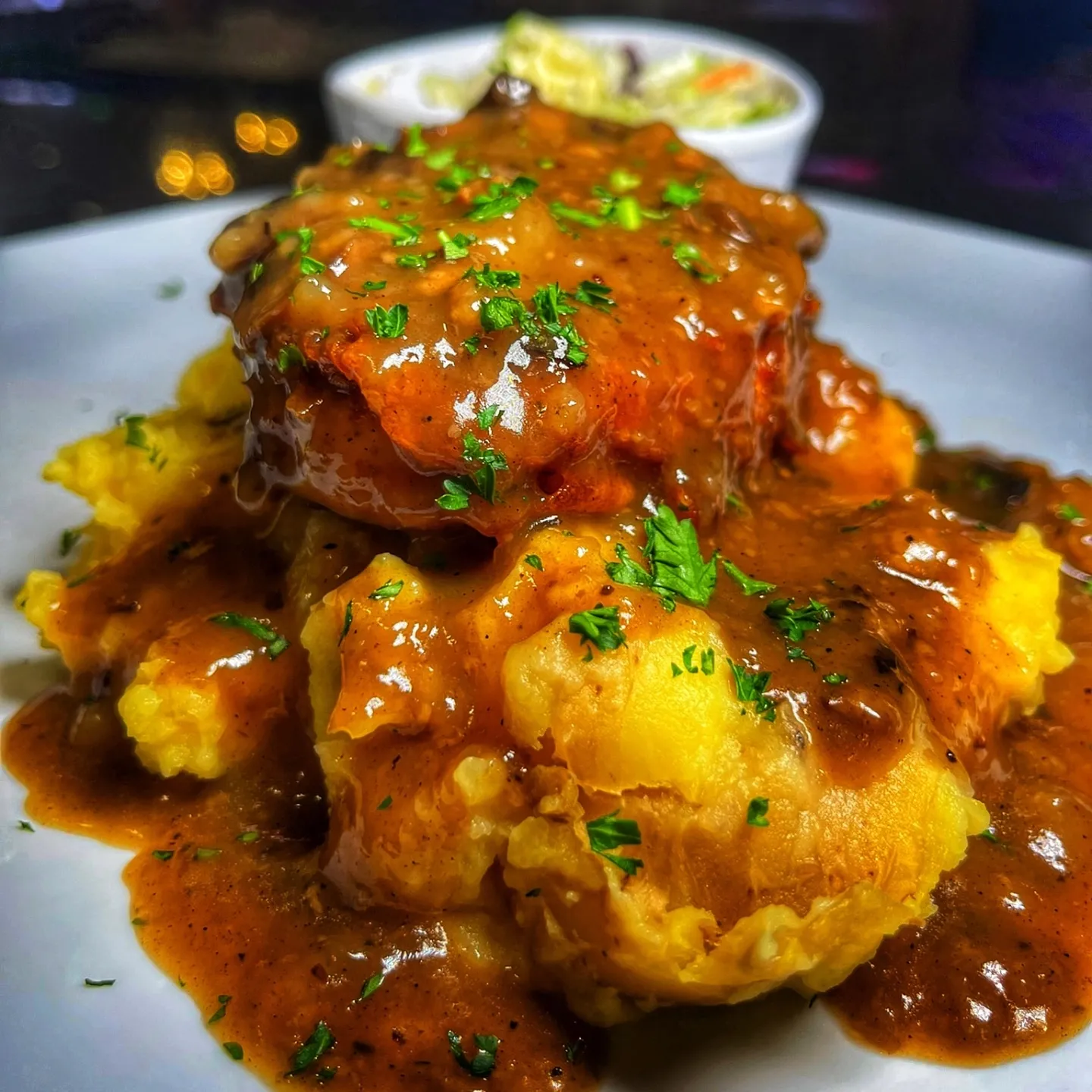 A plate of food with gravy on it.